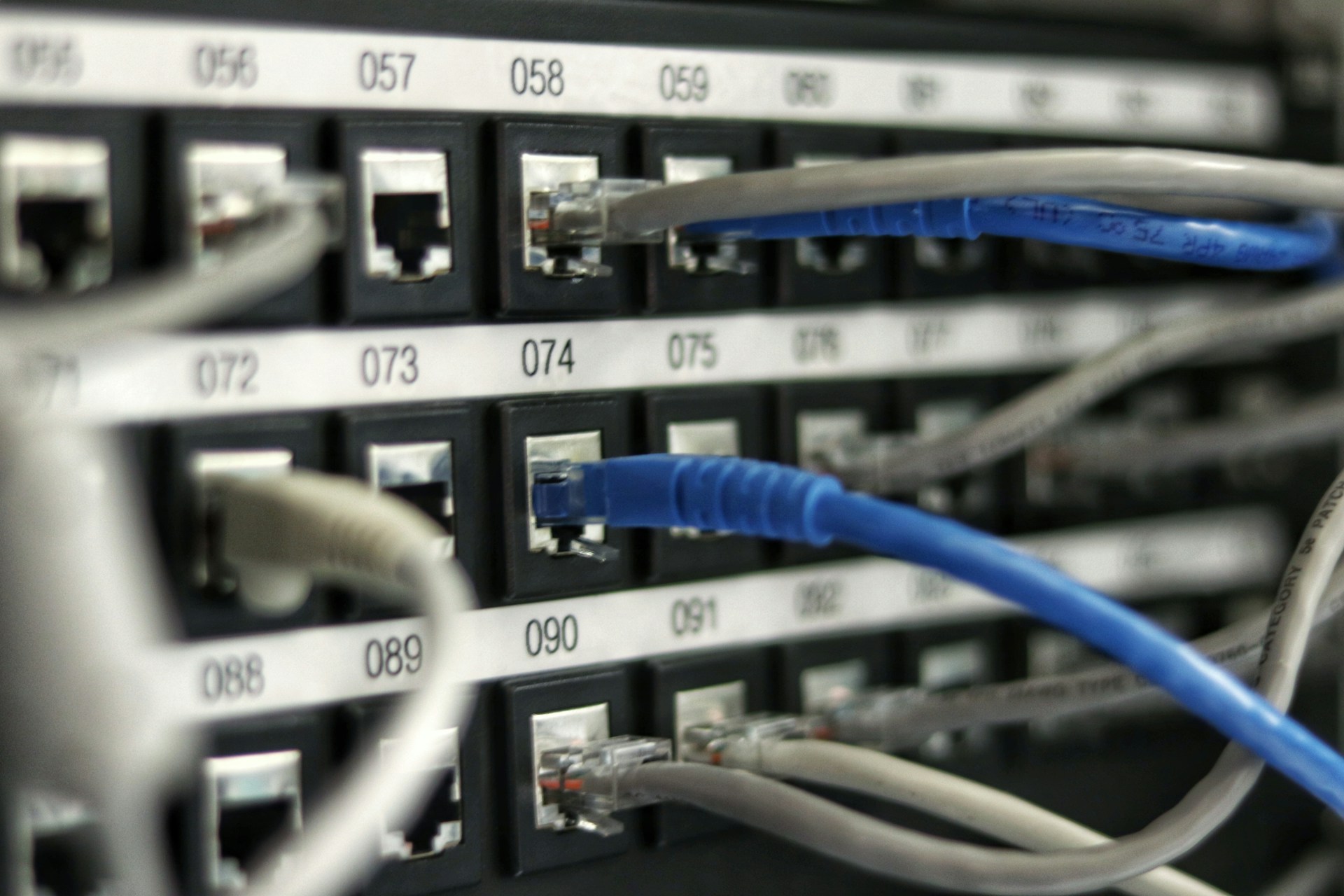 Network switch and ethernet cables in a rack